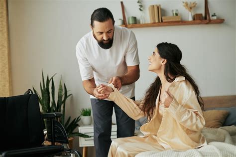 Premium Photo Cheerful Loving Man In Homewear Helping His Disabled