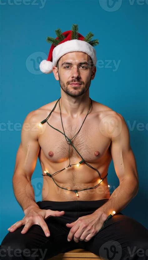 A Portrait Featuring A Gay Man Seated Against A Blue Backdrop Adorned