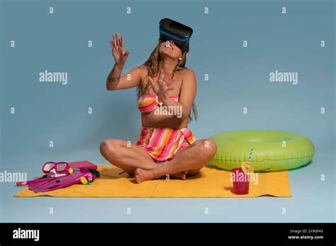 Portrait Of Beautiful Brunette Latina Woman With Long Hair Wearing Virtual Reality Glasses