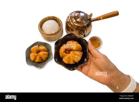 Die Cut Of Fried Steamed Buns Stuff With Red Pork And Cream On White