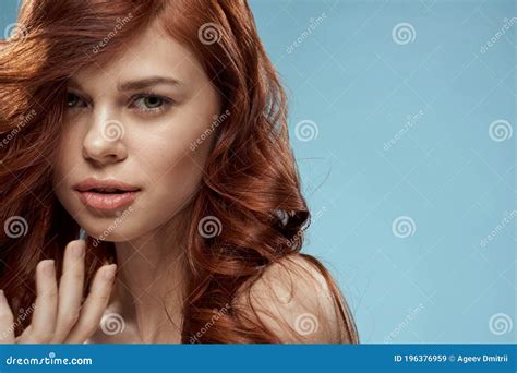 Beautiful Woman Curly Long Hair Smooth Hairstyle Naked Shoulders Cosmetics Care Blue Background