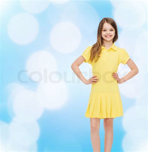 smiling little girl in yellow dress | Stock image | Colourbox