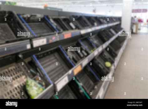 Blurred Interior Background Image Of Empty Supermarket Shelves Due To