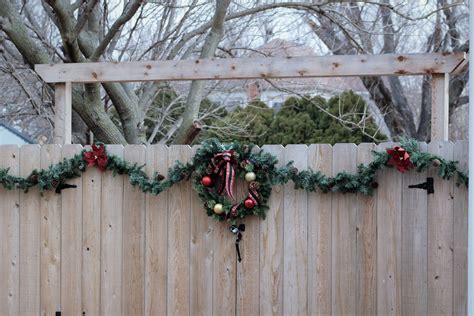 Wreath And Garland On Fence at Thelma Guerrero blog