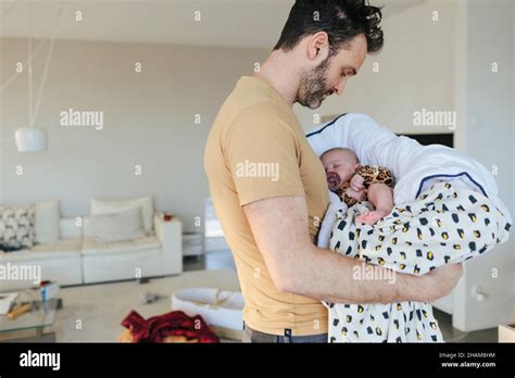 Father Carrying Baby Stock Photo Alamy