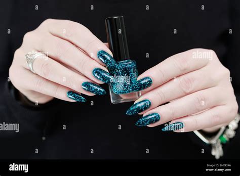 Woman S Beautiful Hand With Long Nails And Teal Green And Blue Manicure