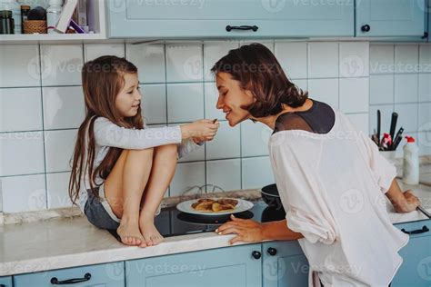 happy family cook together in the kitchen 11339599 Stock Photo at Vecteezy