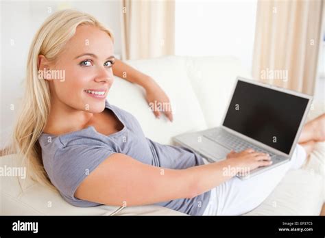 Blonde Woman Switching On Her Laptop Stock Photo Alamy