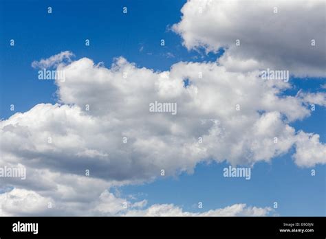 Blue sky with moody clouds Stock Photo - Alamy