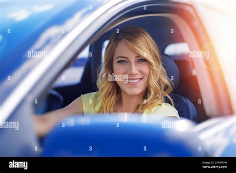 Beautiful Blonde Woman Driving A Car Stock Photo Alamy