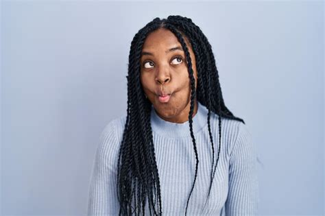 Free Photo African American Woman Standing Over Blue Background