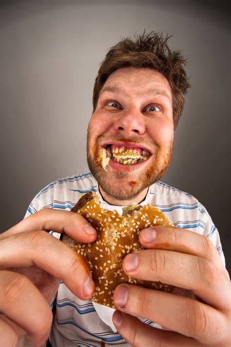 Man Chewing Hamburger Stock Photos Image 19390583