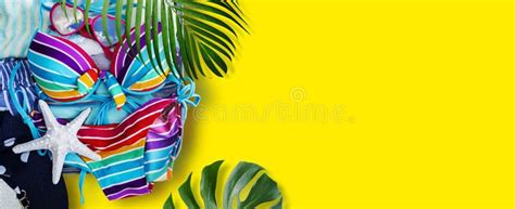 Colorful Bikini And Clothes In Luggage With Tropical Leaves Stock Image