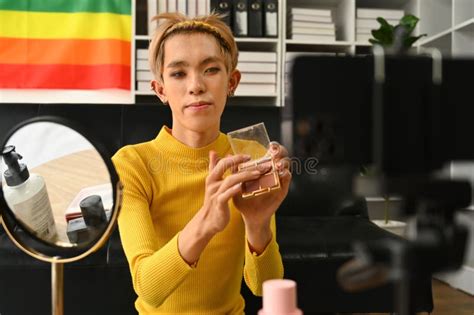 Smiling Asian Gay Man Blogger Filming Daily Makeup Routine Tutorial On Smartphone Lgbtq