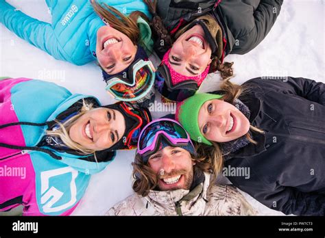 happy group  people  fun  winter vacation friends witn snow