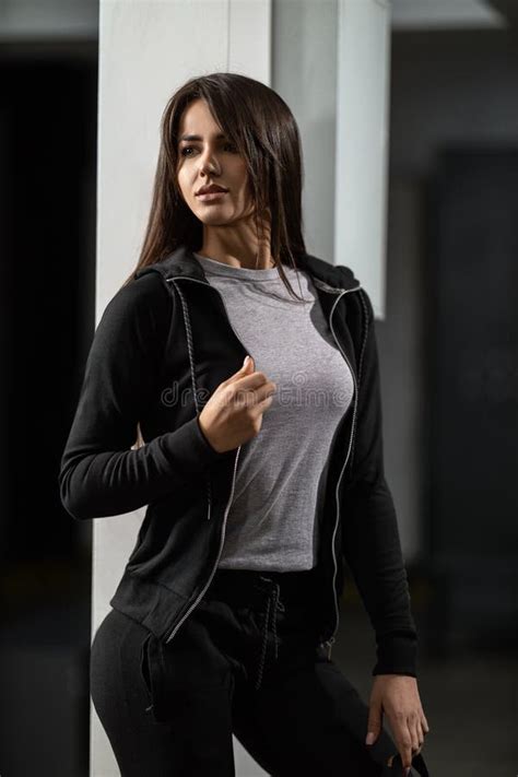 Beautiful Fit Brunette Girl In A Black Tracksuit Holding A Sports Backpack Stock Photo Image