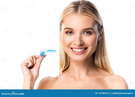 Happy Blonde Woman With White Teeth Holding Mouth Guard On White Stock