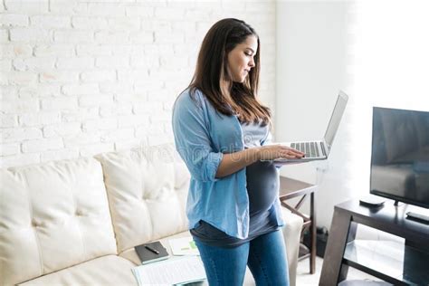 Gorgeous Expectant Mother With Naked Tummy Blowing Kiss Stock Photo Image Of Feeling Jeans