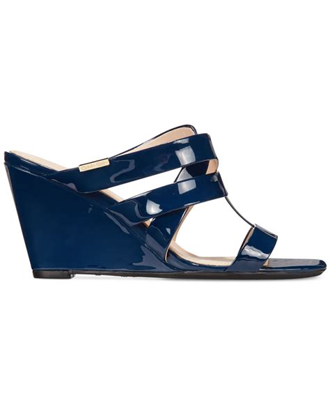 Lyst Calvin Klein Women S Nona Wedge Sandals In Blue