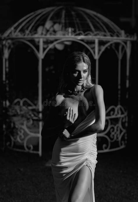 Fashion Model In White Dress Covering Breast With Hand Boobs Tits