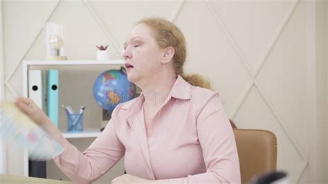 Caucasian Redhead Woman Suffering From Climacteric Changes Senior Lady Having Hot Flashes And