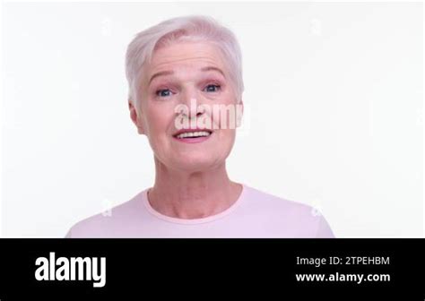 Mature Woman Wears An Expression Of Genuine Astonishment Eyes Wide And