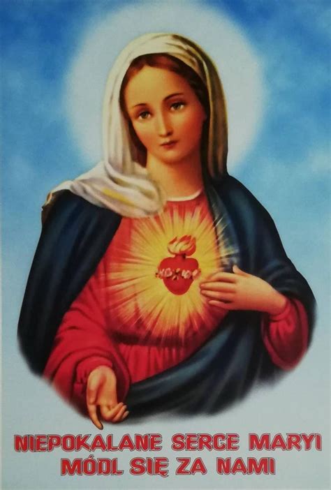 An Image Of The Virgin Mary With Her Heart In Her Hands And Words Above It