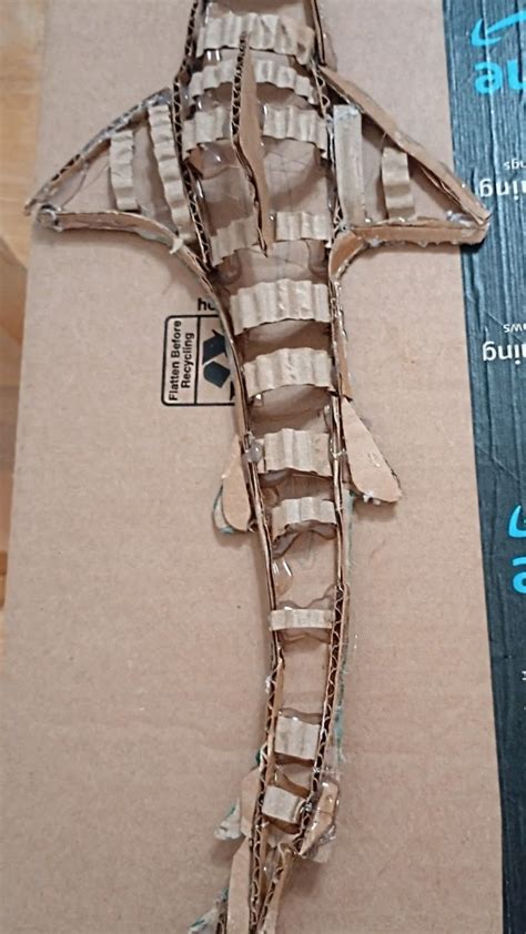 making a cardboard shark | Cardboard art sculpture, Cardboard crafts ...