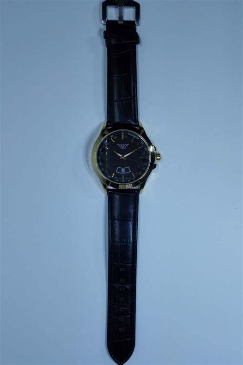 تیسوت - TISSOT - شیک مجلسی جنس بند چرم و قاب استیل رنگ مشکی طلایی