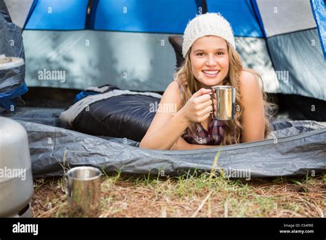 Pretty Blonde Camper Smiling And Lying In Tent Stock Photo Alamy