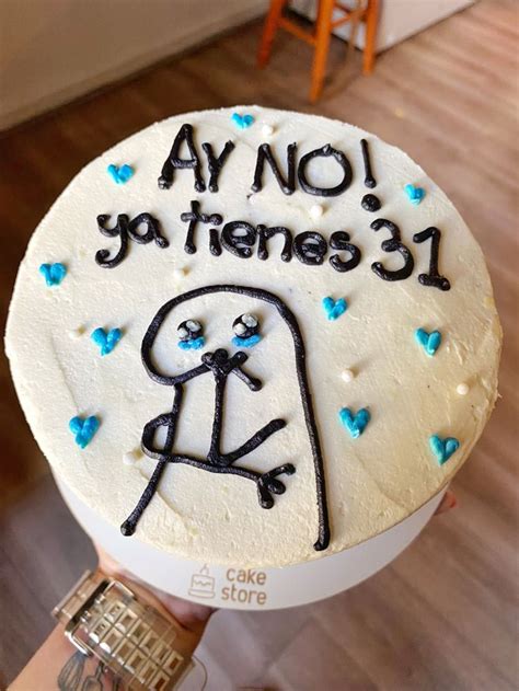 Someone Holding Up A Cake With Writing On It