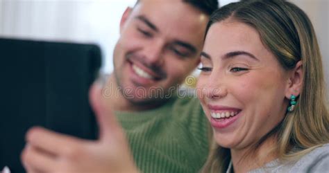 Tablet Social Media And Love With A Couple Laughing At A Meme Online