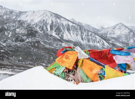 Landscape Of Colorful Buddhist Prayer Flags On Snow Mountain Stock