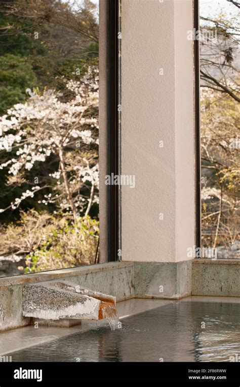Hot Spring Water Flowing Into Pool At Japanese Onsen Stock Photo Alamy