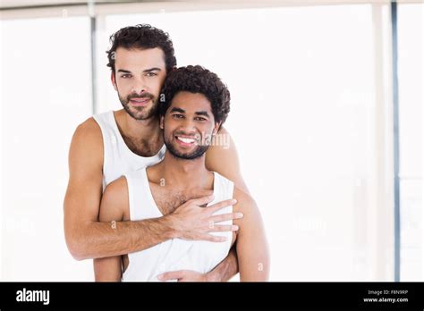 Smiling Gay Couple Hugging Stock Photo Alamy
