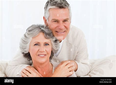 Mature Woman Hugging Her Husband Stock Photo Alamy