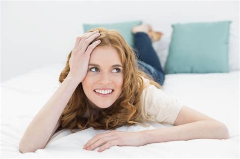 Premium Photo Smiling Thoughtful Pretty Woman In Bed