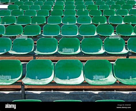 Sports Field With Empty Grandstand With Rows Of Seats For Viewers Stock
