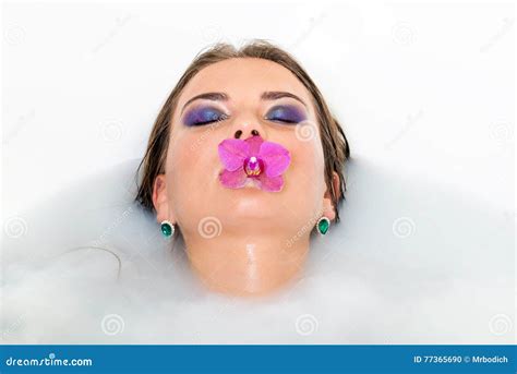 Beautiful Woman Keeps Lily In Mouth Stock Photo Image Of Pink Brunette 77365690