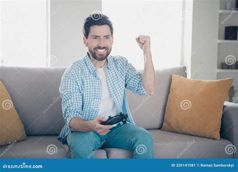 Photo Of Handsome Bearded Alone Mature Age Adult Man Playing Playstation Game Console Holding