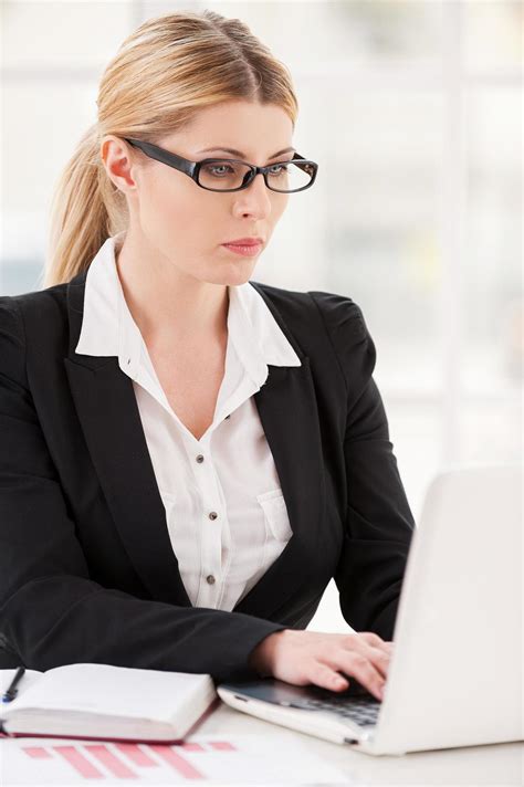 Businesswoman At Her Working Place Serious Mature Woman In Formalwear Working On Laptop While