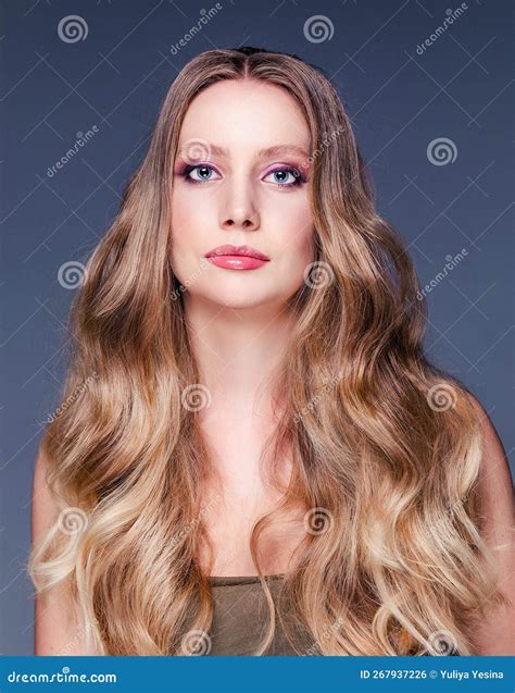 Beautiful Woman With Long And Shiny Wavy Hair And Makeup Model Girl