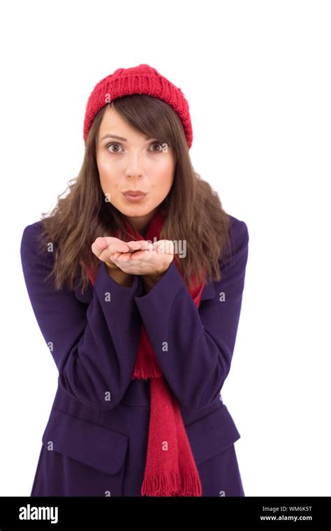 Festive Brunette Blowing Over Hands On White Background Stock Photo Alamy