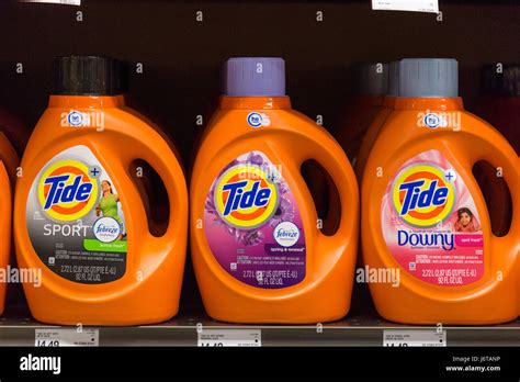 rows  tide brand liquid laundry detergent  grocery store shelves