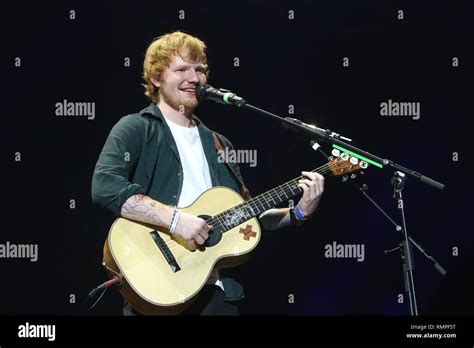 Singer Songwriter And Guitarist Ed Sheeran Is Shown Performing On