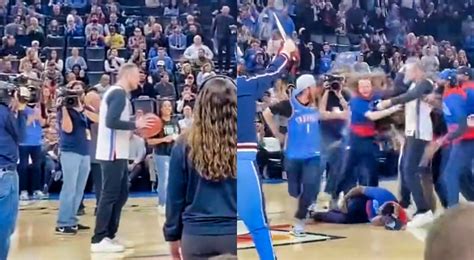 Fan Hits Halfcourt Shot As Guy Smacks His Head On Court