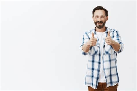 Free Photo Cheerful Smiling Bearded Mature Man Posing