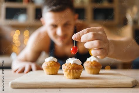 Naked Man In Apron Cooking Dessert On The Kitchen Stock Photo Adobe Stock
