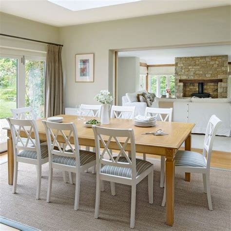 Light Bright Dining Room With White Painted Chairs Bright Dining