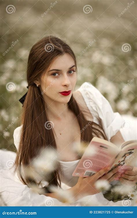 Sexy Blonde Like A Doll In The Bathroom On A Gold Background In Gold Dress Royalty Free Stock